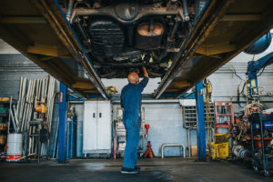 car on lift beginning diagnostic at Bucky's midway auto repair