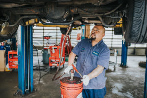 Mechanic changing fluids in car at Bucky's Auto Repair Federal Way