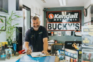 Mechanic preparing documents at Bucky's Bremerton Auto Repair