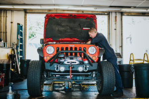 red Jeep being repaired at Bucky's Bremerton Auto Repair
