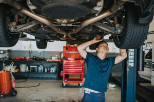 Car being repaired by mechanic at Bucky's Shoreline Auto repair location